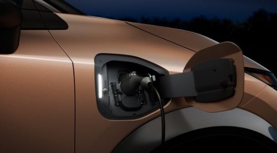 Close-up image of charging cable plugged in | Paul Barnett Nissan in Brookhaven MS